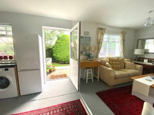 a living room with a door open to a living room at Glenburn, Peaceful Accommodation Fochabers in Fochabers +27 photos
