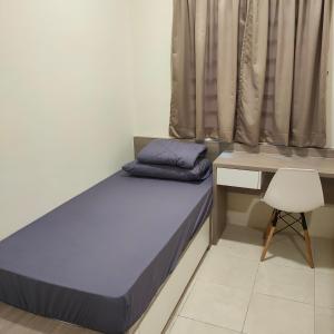 Posteľ alebo postele v izbe v ubytovaní Mimms Homestay Teluk Intan