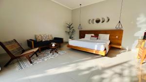 Ein Bett oder Betten in einem Zimmer der Unterkunft Villa Voyage 5