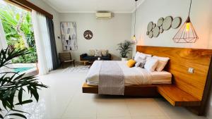 Ein Bett oder Betten in einem Zimmer der Unterkunft Villa Voyage 5