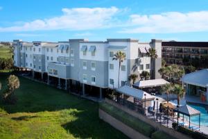 an aerial view of a resort with palm trees at TownePlace Suites by Marriott Galveston Island in Galveston