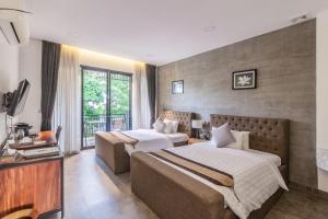 Ένα ή περισσότερα κρεβάτια σε δωμάτιο στο Bamboo Retreat Villa +49 φωτογραφίες