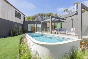 a swimming pool in the backyard of a house at Villa Aquarius - Gas Heated Pool Spa Luxury in Blairgowrie