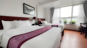 Postel nebo postele na pokoji v ubytování Sapa Lake View Hotel