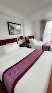 Postel nebo postele na pokoji v ubytování Sapa Lake View Hotel