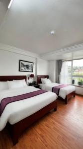 Postel nebo postele na pokoji v ubytování Sapa Lake View Hotel