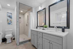 a bathroom with a sink and a shower and a toilet at Ski Lover's Paradise- 7BR Villa Near Top Resorts home in Holladay