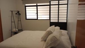 Postel nebo postele na pokoji v ubytování Orizaba Suites