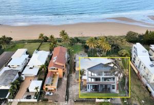 an aerial view of a house next to the beach at Horizons Unit 4 Beachfront Unit in Bargara