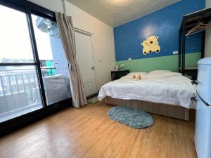 Voodi või voodid majutusasutuse Chaonima B&B 潮尼馬民宿 toas