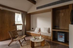 Posezení v ubytování Shijing Hotel in Dali-大理柿井美宿