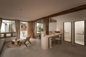 Posezení v ubytování Shijing Hotel in Dali-大理柿井美宿