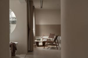 Posezení v ubytování Shijing Hotel in Dali-大理柿井美宿