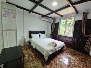 Letto o letti in una camera di Koh Mak Garden View