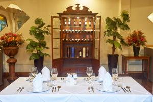 a table in a room with wine bottles at Xima Arequipa Crismar in Arequipa