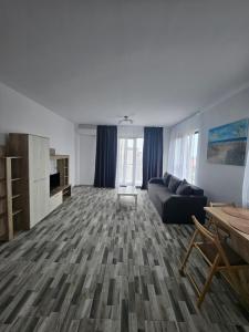 En eller flere senge i et værelse på Lakeview Apartament