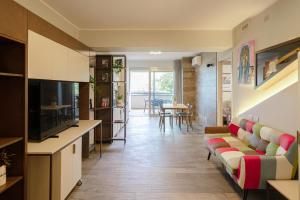 a living room with a couch and a table at ArtRock Apartments in Giulianova