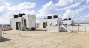 a building with two turbines on top of it at Luxurious 3 Bed 4 Bath Condo in Nairobi