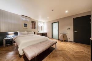Postel nebo postele na pokoji v ubytování Yangju Hotel NO25