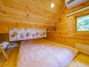 Postel nebo postele na pokoji v ubytování UMIOTO log