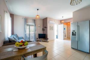 a living room with a bowl of fruit on a table at Villa SteMMa in Chania Town