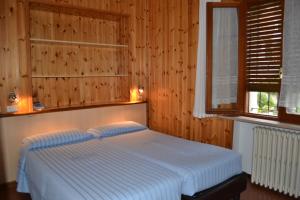 Postel nebo postele na pokoji v ubytování Hotel Miramonti