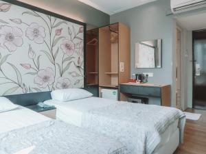 Postel nebo postele na pokoji v ubytování Hi Hotel Dot