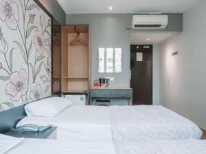 Postel nebo postele na pokoji v ubytování Hi Hotel Dot