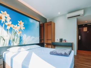 Postel nebo postele na pokoji v ubytování Hi Hotel Dot