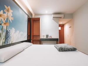 Postel nebo postele na pokoji v ubytování Hi Hotel Dot