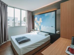 Postel nebo postele na pokoji v ubytování Hi Hotel Dot