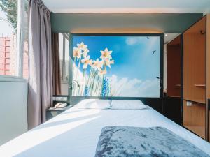 Postel nebo postele na pokoji v ubytování Hi Hotel Dot