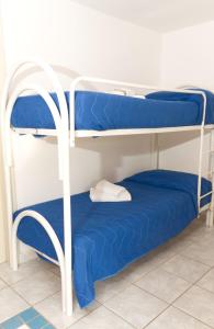 Postel nebo postele na pokoji v ubytování Residence Arco delle Rose
