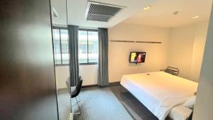 Кровать или кровати в номере S33 Compact Sukhumvit Hotel