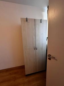a closet with a door in a room at Central Apartment Sunny beach in Sunny Beach +8 photos