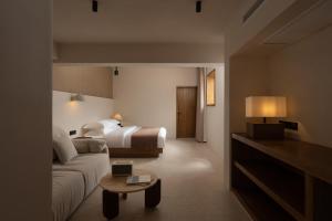 Postel nebo postele na pokoji v ubytování Shijing Hotel in Dali-大理柿井美宿