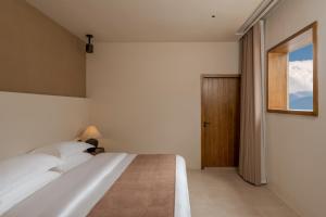 Postel nebo postele na pokoji v ubytování Shijing Hotel in Dali-大理柿井美宿