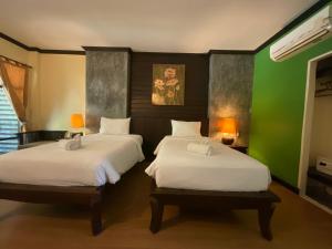 Rúm í herbergi á Seashell Resort Koh Tao-SHA Plus