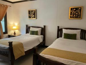 Rúm í herbergi á Seashell Resort Koh Tao-SHA Plus