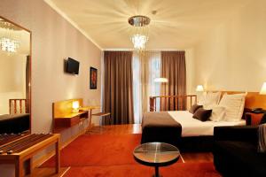 TV a/nebo společenská místnost v ubytování Hotel Mestre de Avis