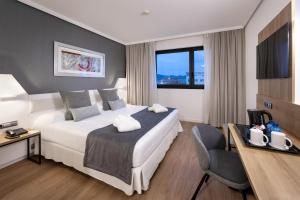 A bed or beds in a room at Alexandre FrontAir Congress