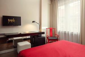 Postel nebo postele na pokoji v ubytování Perla Hotel