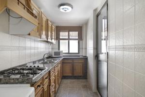 Kuchyň nebo kuchyňský kout v ubytování Apartamento Ramón + 17 fotografií