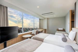 Postel nebo postele na pokoji v ubytování ART HOTEL Nippori Lungwood