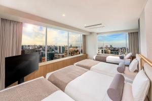 TV a/nebo společenská místnost v ubytování ART HOTEL Nippori Lungwood