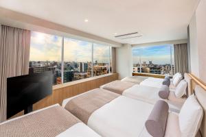 TV a/nebo společenská místnost v ubytování ART HOTEL Nippori Lungwood