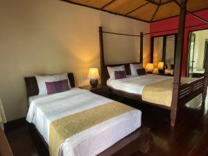 Rúm í herbergi á Seashell Resort Koh Tao-SHA Plus