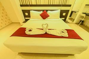 Voodi või voodid majutusasutuse Yuvraj Palace Inn toas