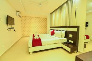 Voodi või voodid majutusasutuse Yuvraj Palace Inn toas