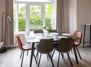 a dining room with a table and chairs at No 1 Killarney Holiday Village Vacation Home in Killarney